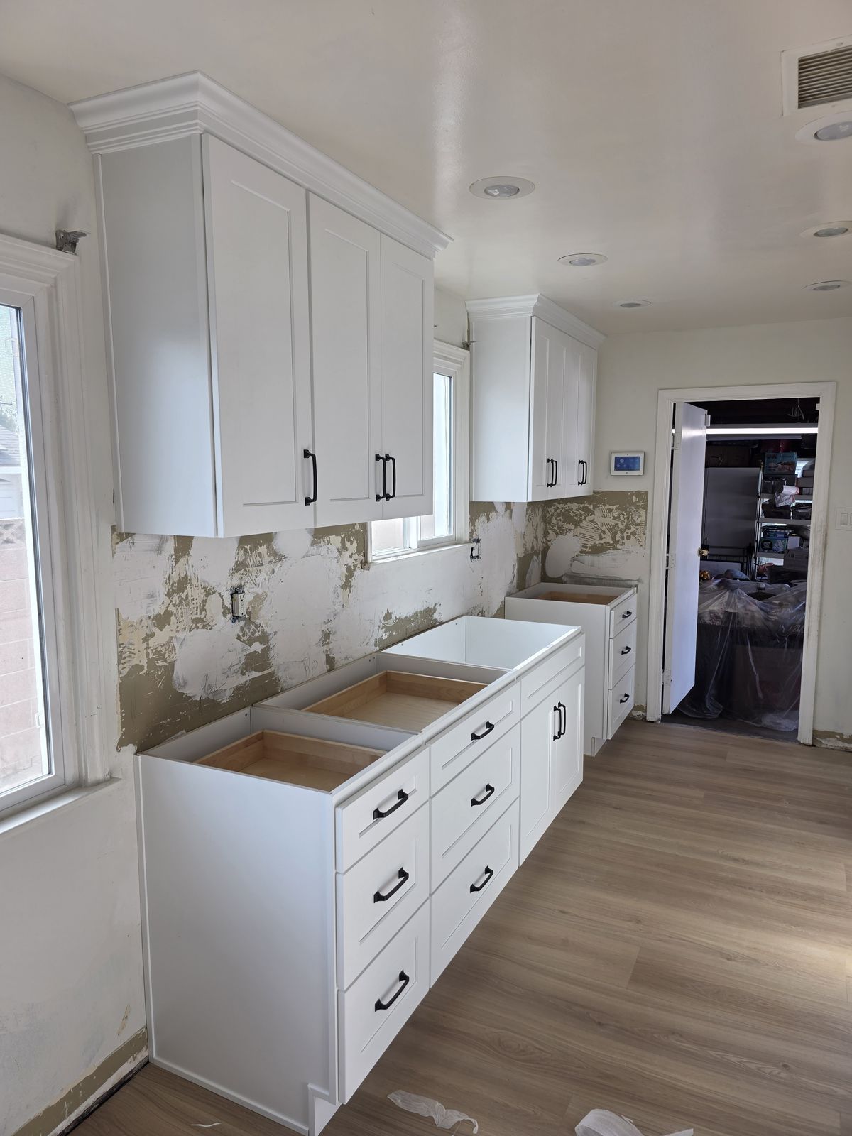 Base cabinets being installed during kitchen remodel, Buena Park
