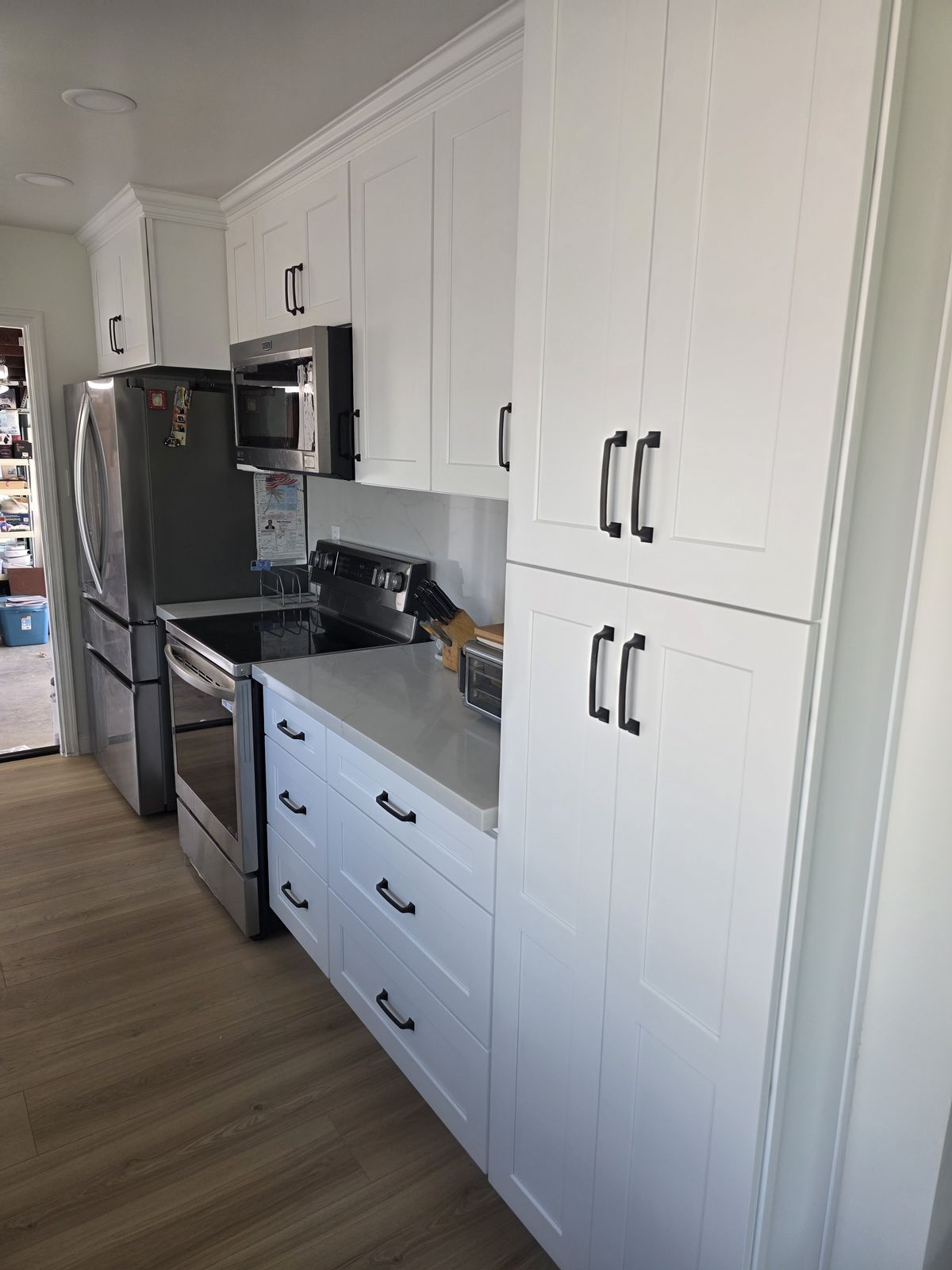 White shaker kitchen with quartz countertops and stainless appliances, Buena Park